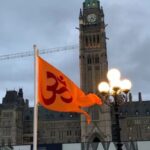 Saffron flag hoisted on Parliament Hill of Canada