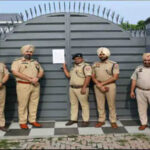 Police sealing the property of a drug smuggler in Ludhiana