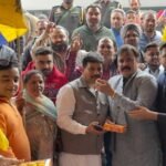 To celebrate the big victory in the by-election, MLA Raman Arora distributed laddus in his constituency and played drums