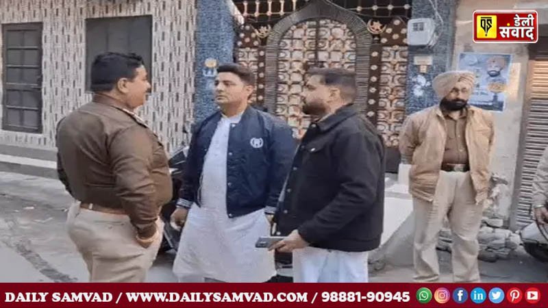 Police officers talking to the girl's neighbours.