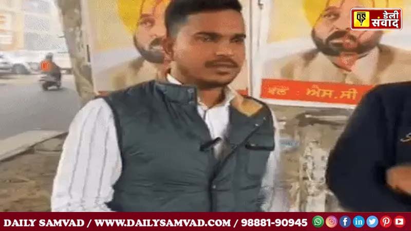 Rahul Dulgach talking to his colleagues.