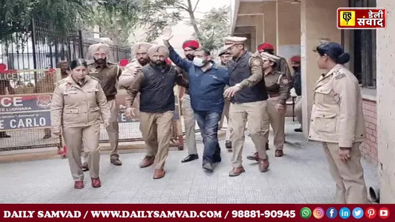 Police officers taking Rajiv Raja, a close aide of Union Minister of State, to the police station after presenting him in court.