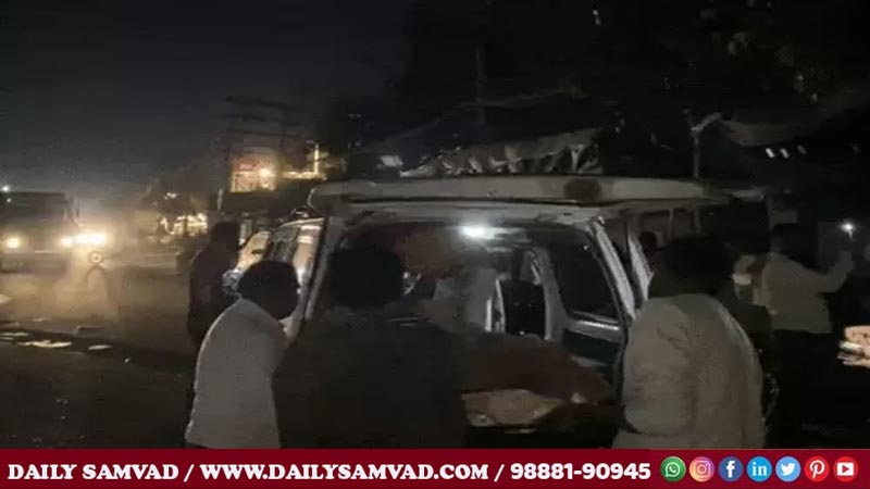 People taking the recovered body in an ambulance.