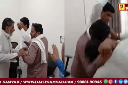 Villager pulling Dharmpal Sharma's companion (wearing a checked shirt) by his hand.