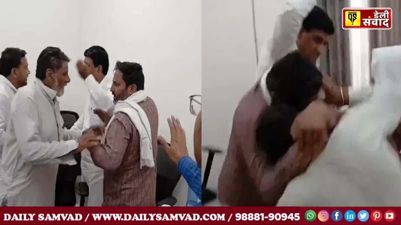 Villager pulling Dharmpal Sharma's companion (wearing a checked shirt) by his hand.
