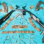 Two AK-series assault rifles and a modern pistol recovered