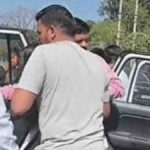 The mayor taking the injured girl to the hospital after the accident.