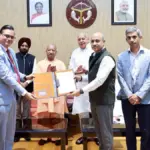 CM Yogi Hands Over Land Allotment Letter to BEL Chairman
