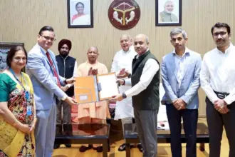CM Yogi Hands Over Land Allotment Letter to BEL Chairman